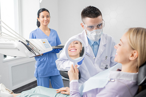Dentist with team at work